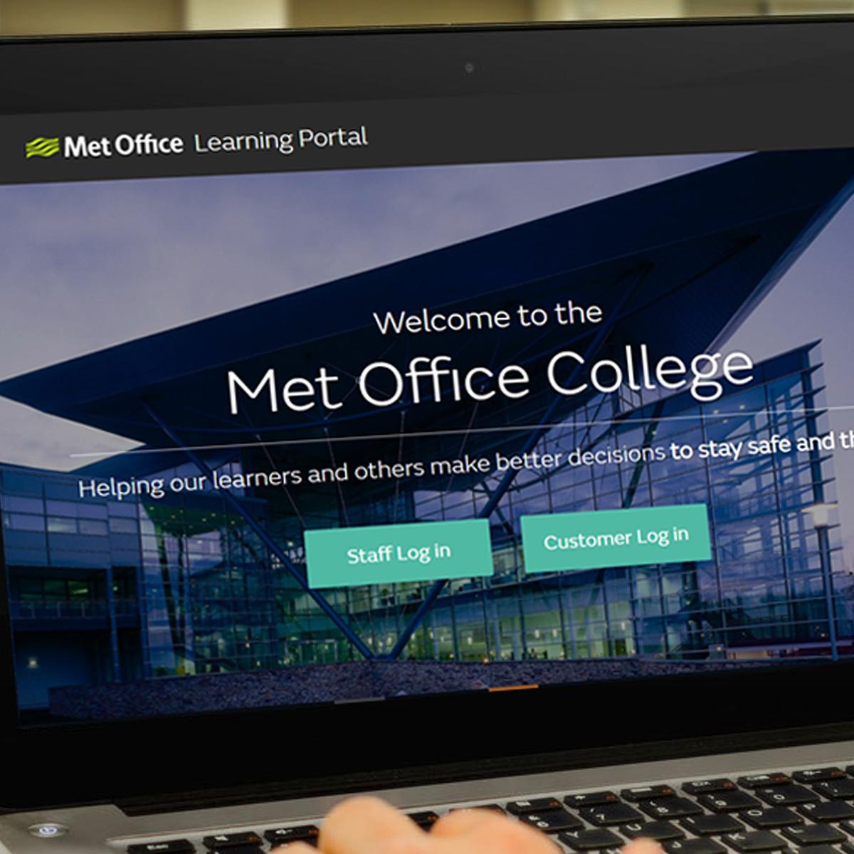 Laptop sitting on a desk with a screenshot of the Met Office website