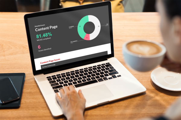 An open laptop displaying Pictured: A dashboard displaying the compliance of a content page to WCAG from an accessibility audit