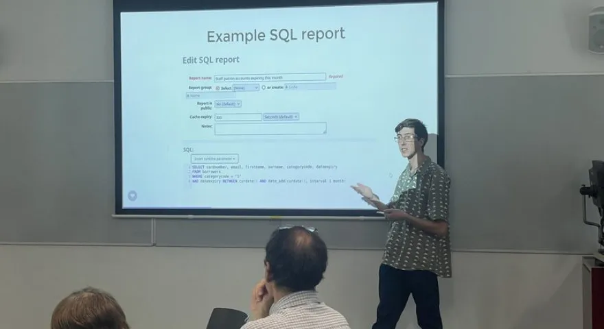 Alex Buckley presenting about the Koha reports module at the AUT hosted user group in Tamaki Makaurau Auckland
