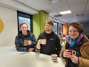  James, Marni, and Sasha holding hot chocolates.