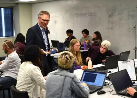 Director Don Christie talks with students at the 2019 Open Source Academy