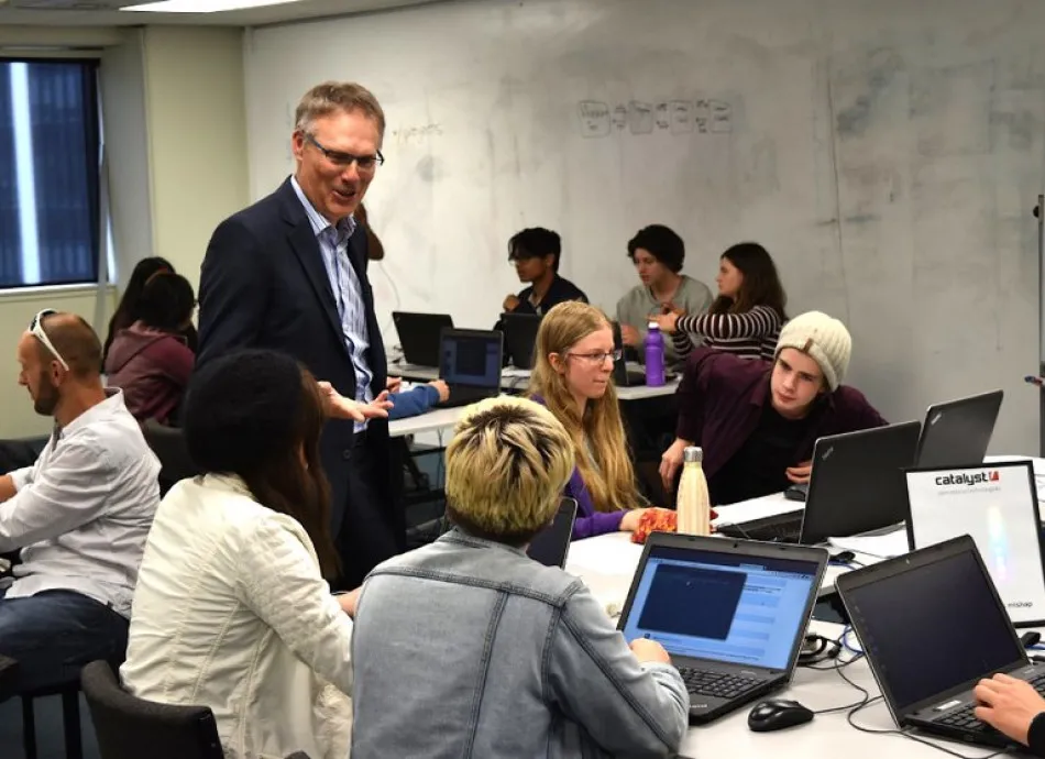Director Don Christie talks with students at the 2019 Open Source Academy