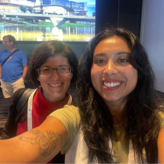 Trish Hepworth smiles in a selfie with Aleisha Amohia at the Everything Open 2025 conference.