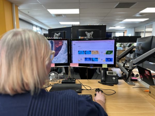 An over the shoulder view of Katherine looking at her screen that displays the Tōtara catalouge
