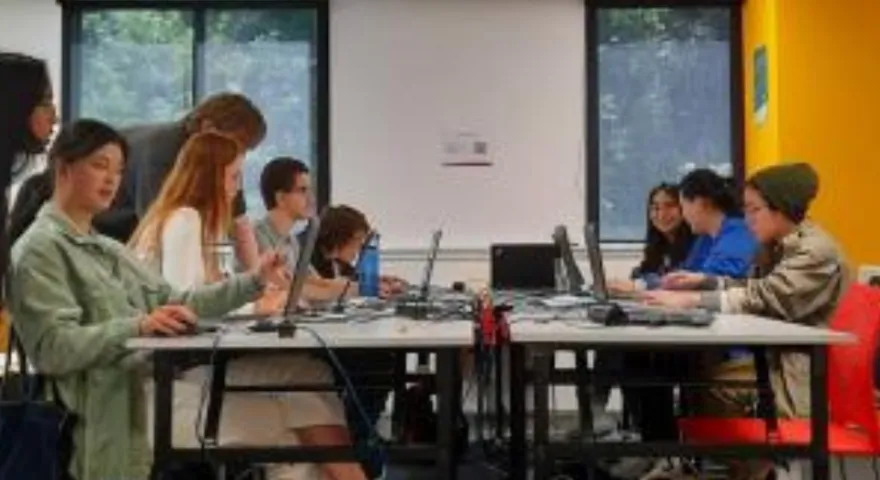 Open source academy students learning how to code