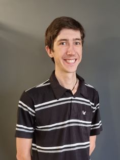 Smiling headshot of Alex Buckley 