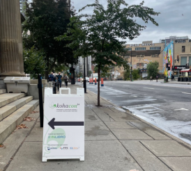 Picture of a sign pointing to where to enter for KohaCon24