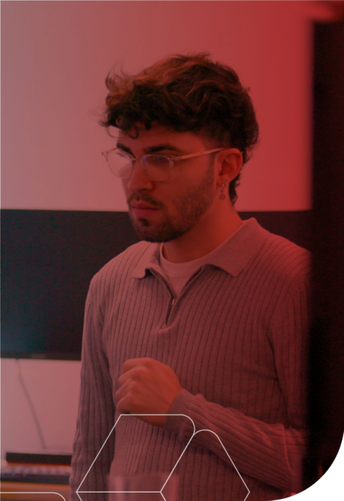 A man wearing glasses focuses