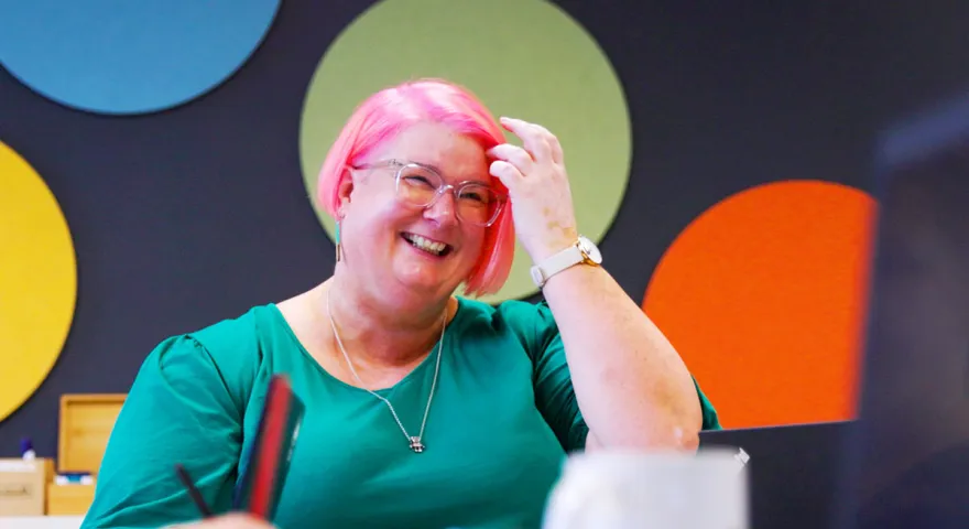 colourful laughing woman in meeting