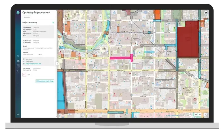 A laptop open on Forward Works Viewer displays a map showing cycleway improvement project with the main project details