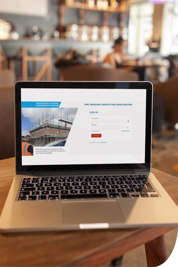 Laptop open on a table displaying the booking page on the PBC website for booking a building consult