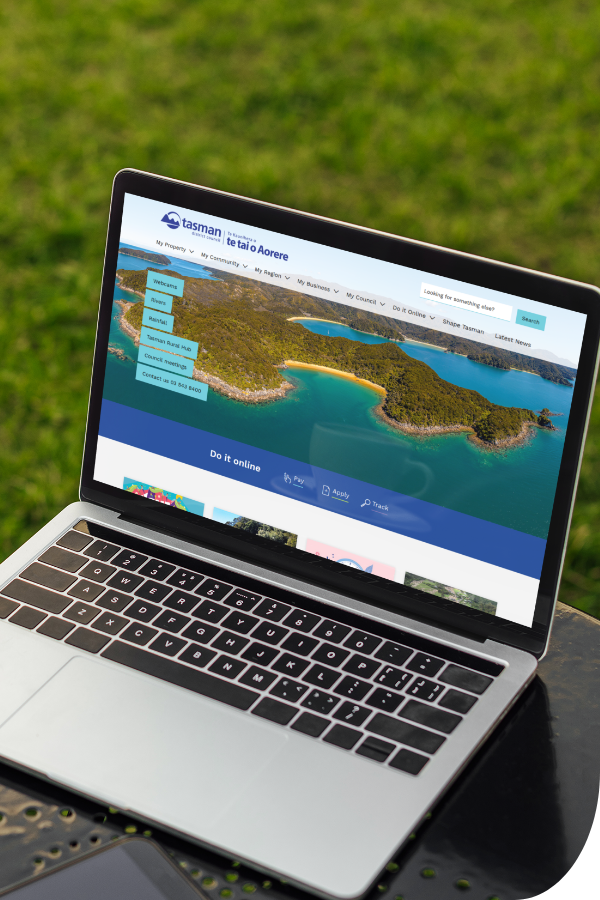 Open laptop displaying the Tasman District Council website homepage