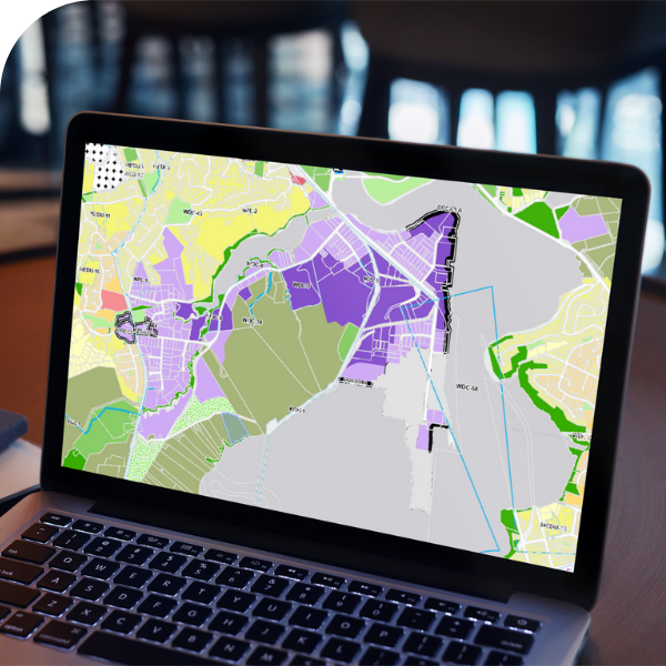 A laptop open displaying a map highlighting different sections of the location