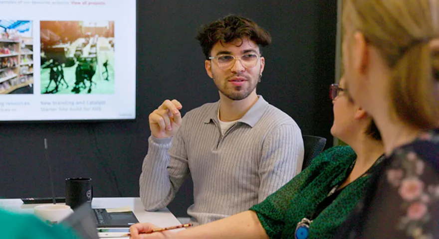 people discussing website in meeting