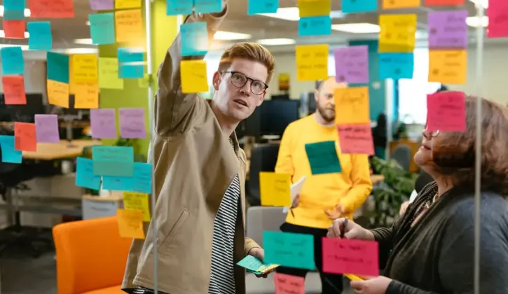 A man working through a strategy outlined on notes