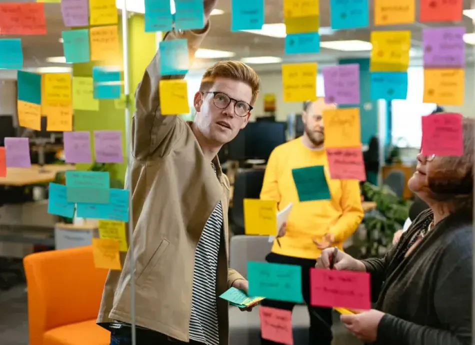 A man working through a strategy outlined on notes