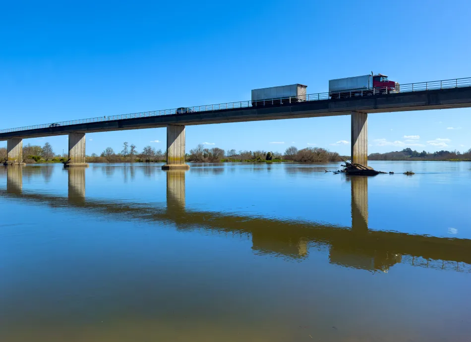Waikato River, New Zealand. Single-lane Rangiriri Bridge with truck and trailer. Also known as Glen Murray Road Bridge.