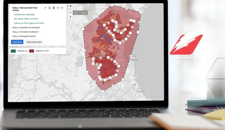 A laptop open on a microsite from RiskScape displaying a map of flooding by the Ngaruroro River and what buildings would be the most exposed